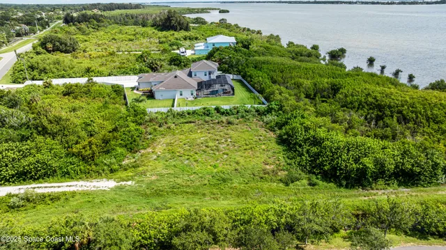 a view of a garden with a building