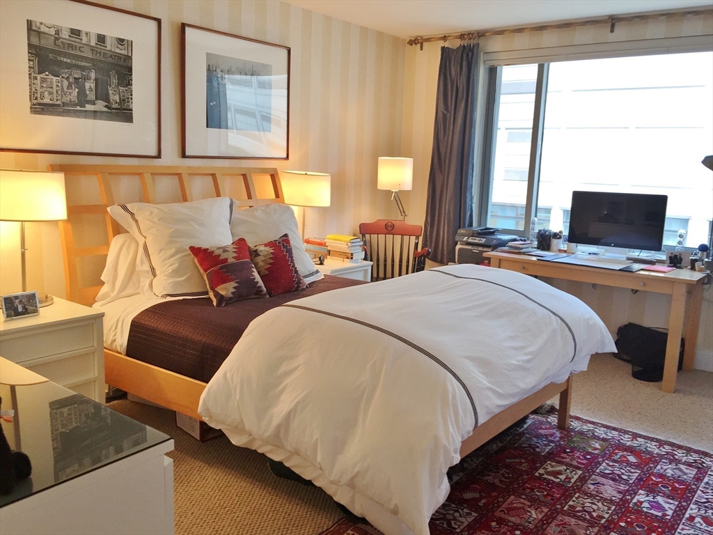 1 Huntington Avenue, Unit 405 Boston, MA 02116 - Photo 5 of 12 a bedroom with a bed and window