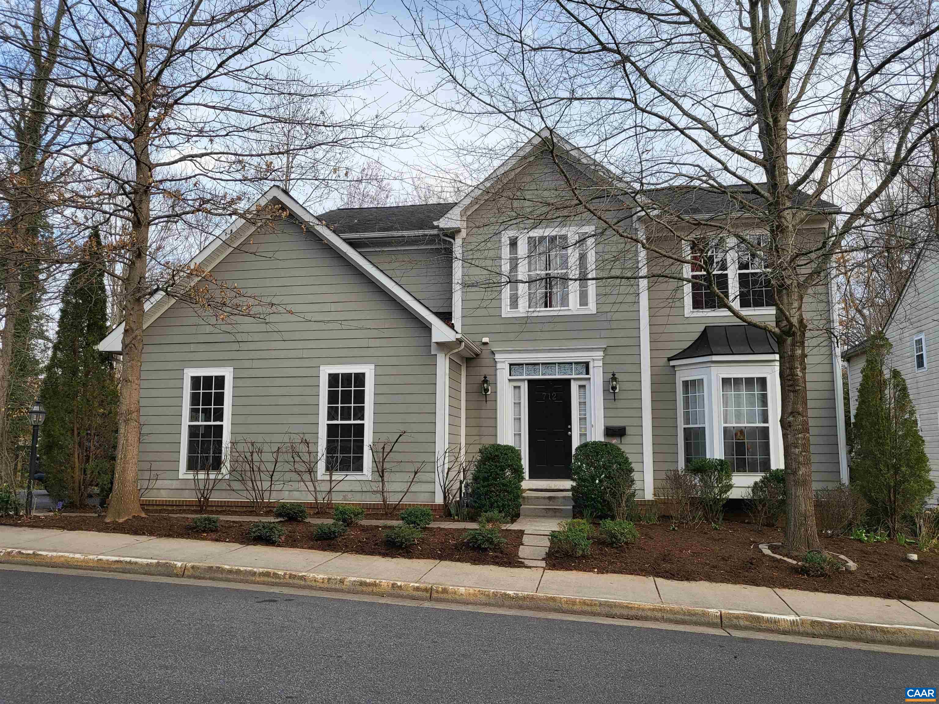 712 Rainier Road Charlottesville, VA 22903 - Photo 1 of 11 a front view of a house with a yard and garage