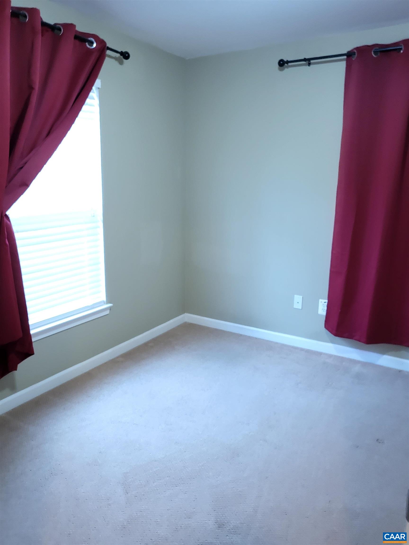 712 Rainier Road Charlottesville, VA 22903 - Photo 9 of 11 a view of an empty room with a window