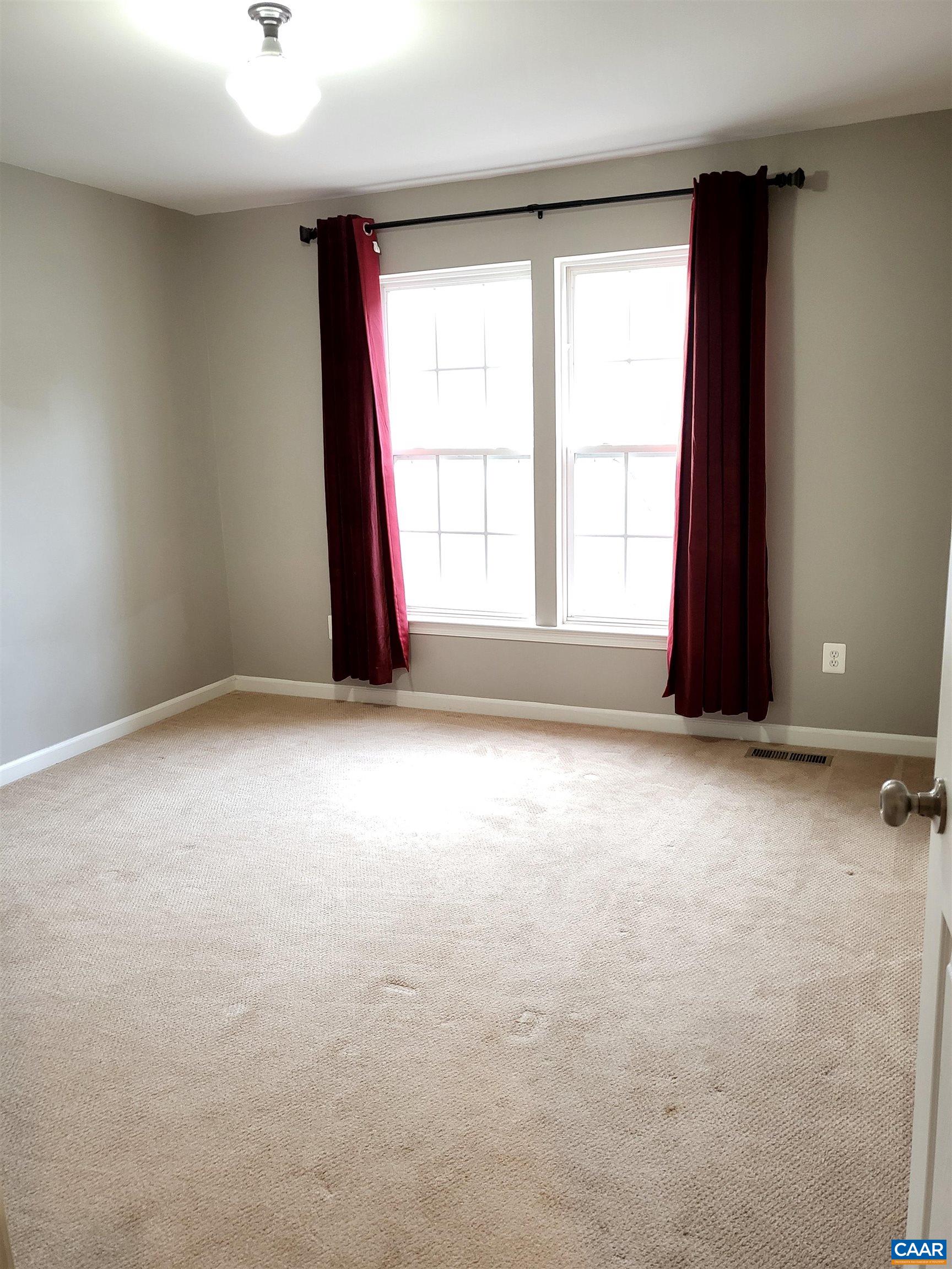 712 Rainier Road Charlottesville, VA 22903 - Photo 10 of 11 an empty room with windows
