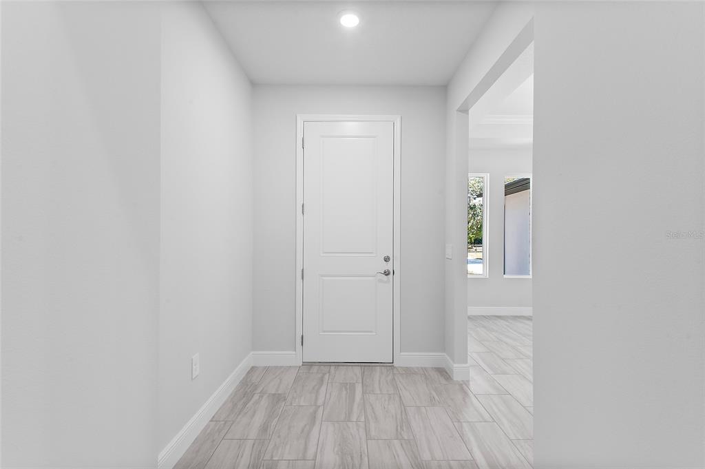 304 North Jungle Road Geneva, FL 32732 - Photo 35 of 49 a view of a small space with wooden floor and a window