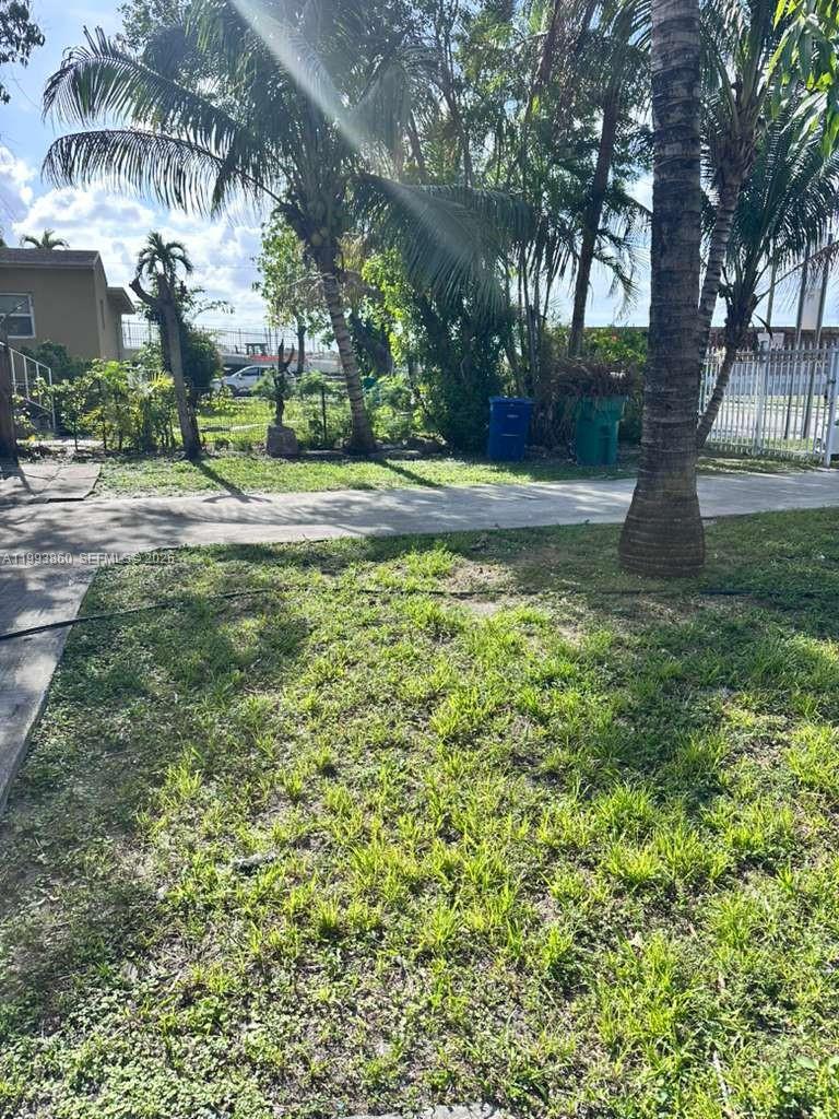 576 Northwest 147th Street, Unit 576 Miami, FL 33168 - Photo 18 of 18 a view of yard with green space