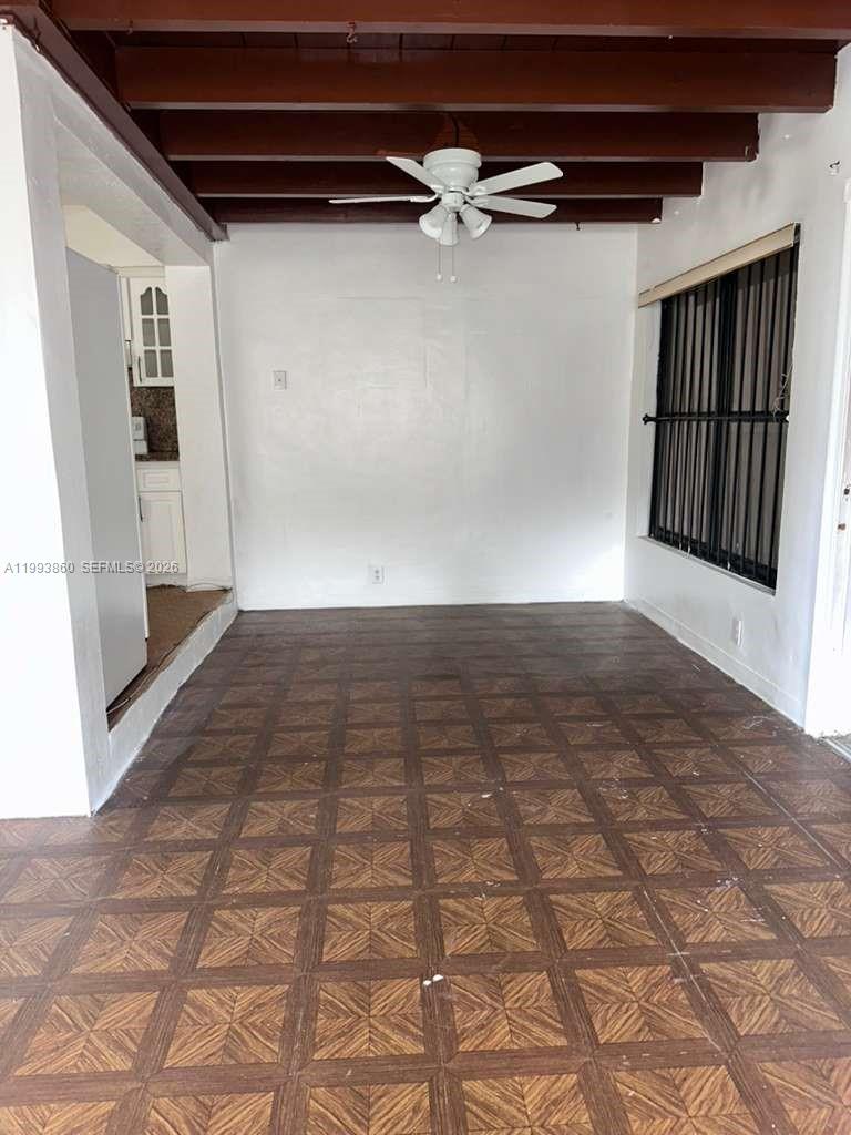 576 Northwest 147th Street, Unit 576 Miami, FL 33168 - Photo 8 of 18 a view of a hallway with wooden floor