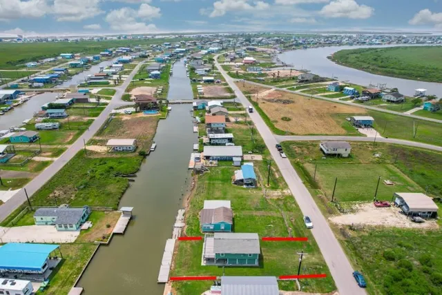 a view of a lake with boats and trees in the background