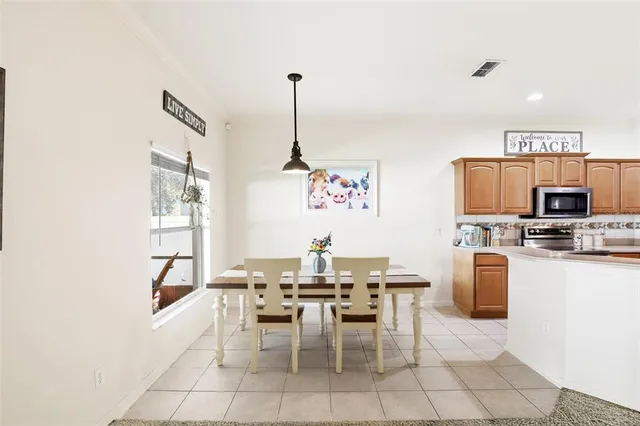 a view of a dining room with furniture