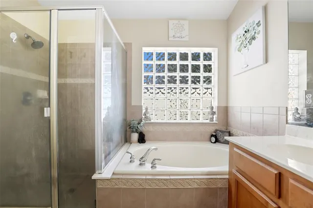 a bathroom with a bathtub and a sink