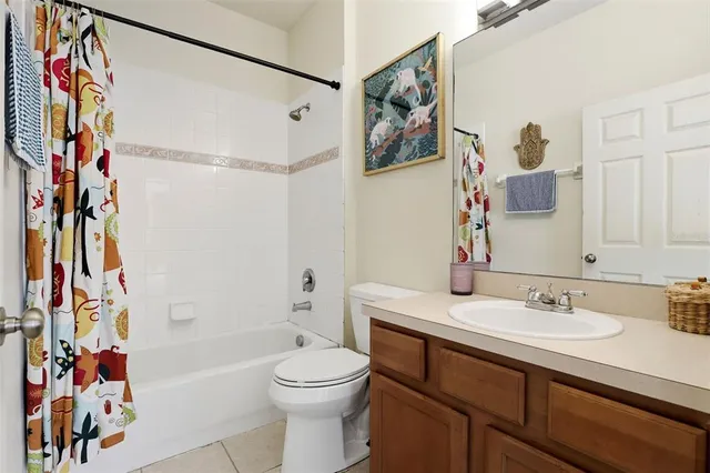a bathroom with a sink a toilet and a bathtub