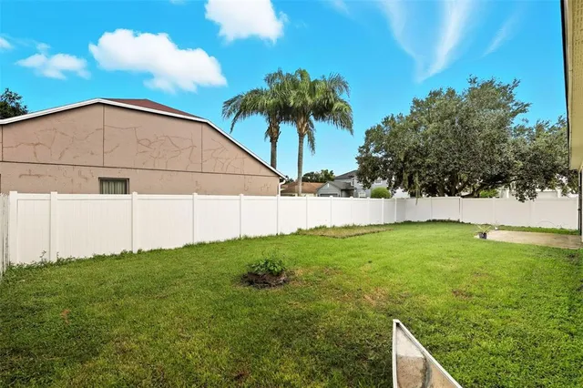 a backyard of a house with lots of green space