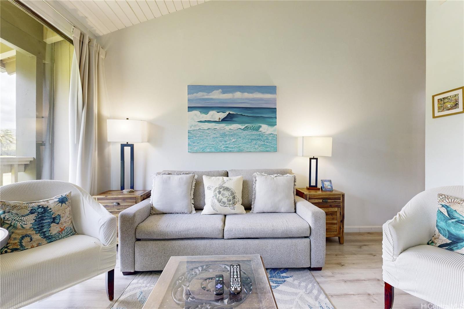 57-101 Kuilima Drive, Unit 132F Kahuku, HI 96731 - Photo 16 of 25 a living room with furniture and a window