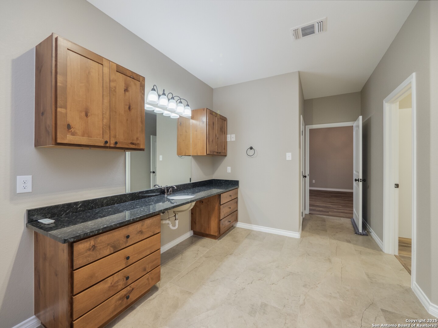 182 Inwood Poteet, TX 78065 - Photo 14 of 45 a kitchen with granite countertop white cabinets and stainless steel appliances