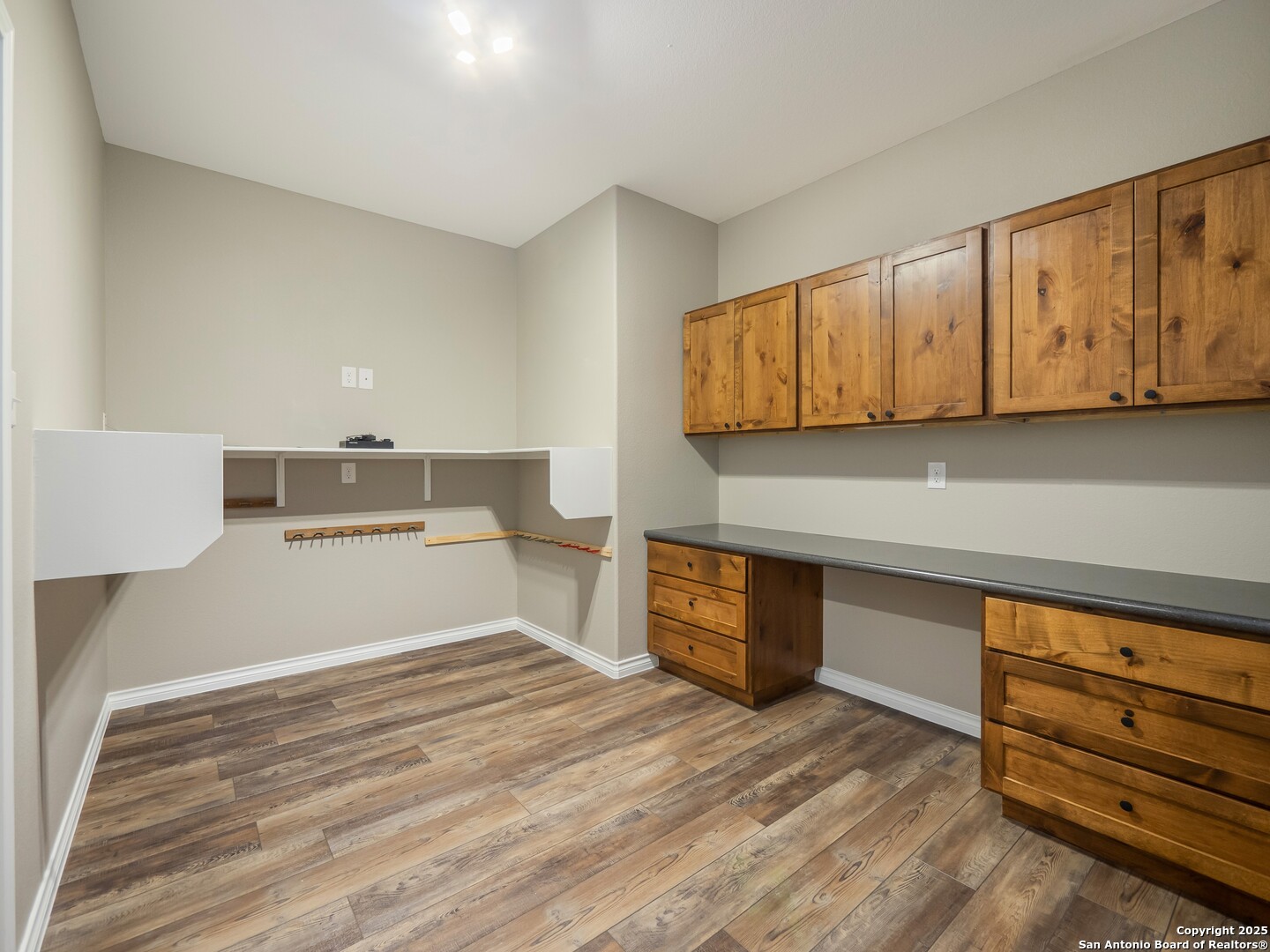 182 Inwood Poteet, TX 78065 - Photo 20 of 45 a view of a kitchen with wooden cabinet and staircase
