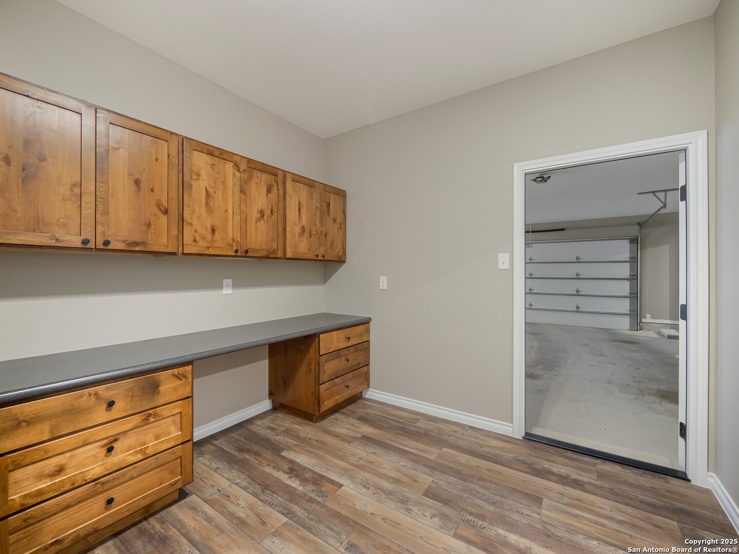 182 Inwood Poteet, TX 78065 - Photo 21 of 45 a view of room with wooden floor