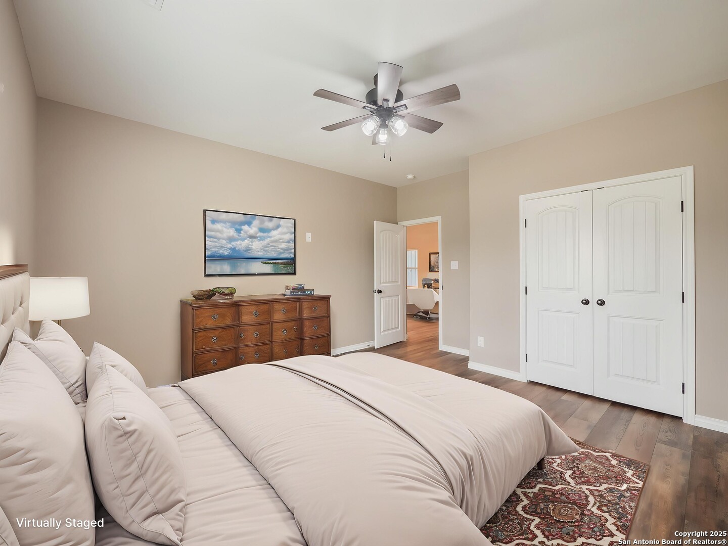 182 Inwood Poteet, TX 78065 - Photo 26 of 45 a bedroom with a bed and a chandelier