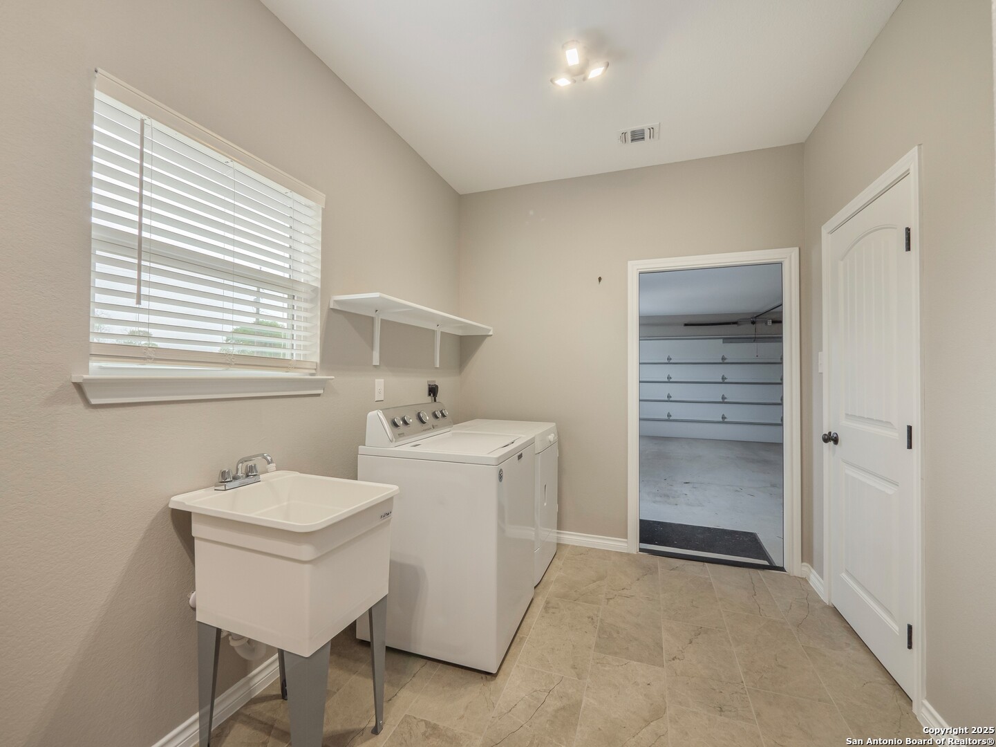 182 Inwood Poteet, TX 78065 - Photo 29 of 45 a bathroom with a sink and a mirror