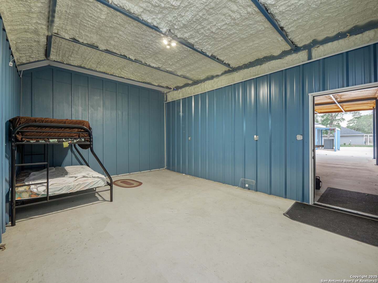 182 Inwood Poteet, TX 78065 - Photo 33 of 45 a bedroom with a bed and a window