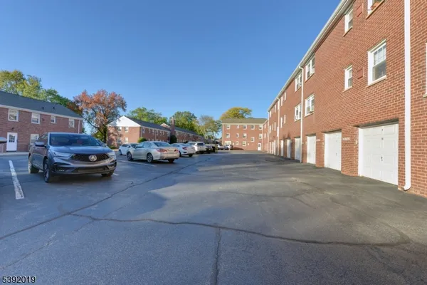 a view of street with parked cars