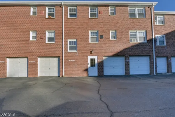 a front view of a house with a garage