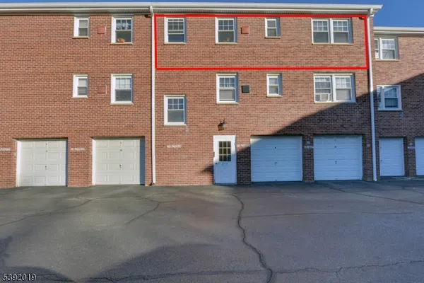 a front view of a house with a garage