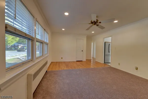 a view of an empty room with a window