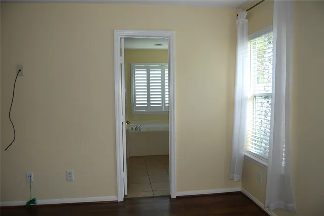 a white bath tub sitting next to a white sink