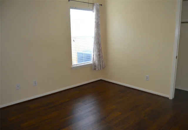 a view of a wooden door of the house