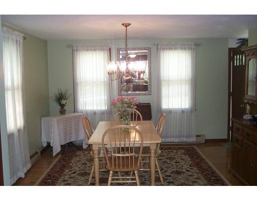 446 Spring Street Hanson, MA 02341 - Photo 4 of 12 a living room with furniture and a window