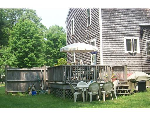 446 Spring Street Hanson, MA 02341 - Photo 10 of 12 a front view of a house with a yard and table and chairs
