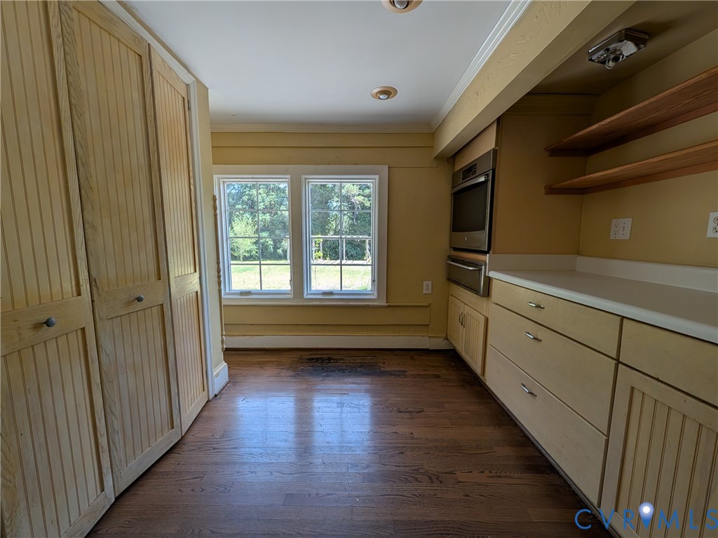 12307 Buckingham Street Chester, VA 23831 - Photo 16 of 40 a view of hallway with wooden floor and fan
