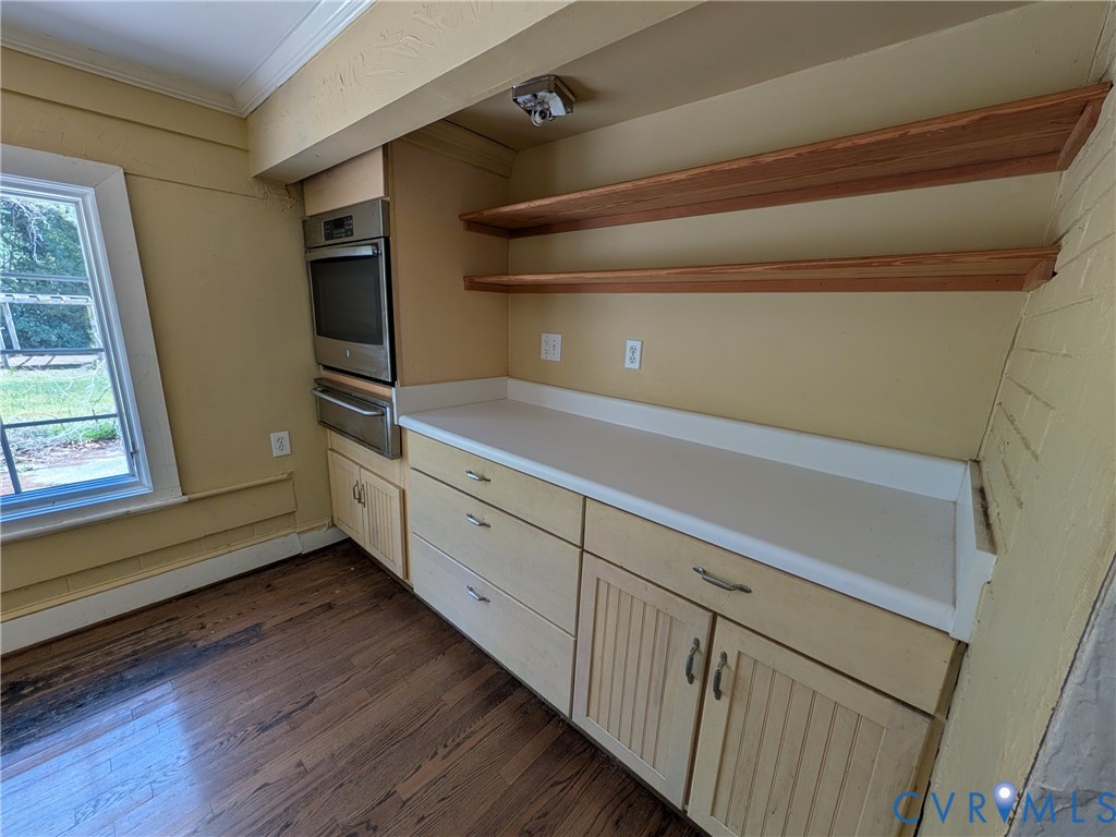 12307 Buckingham Street Chester, VA 23831 - Photo 17 of 40 a kitchen with cabinets and wooden floor
