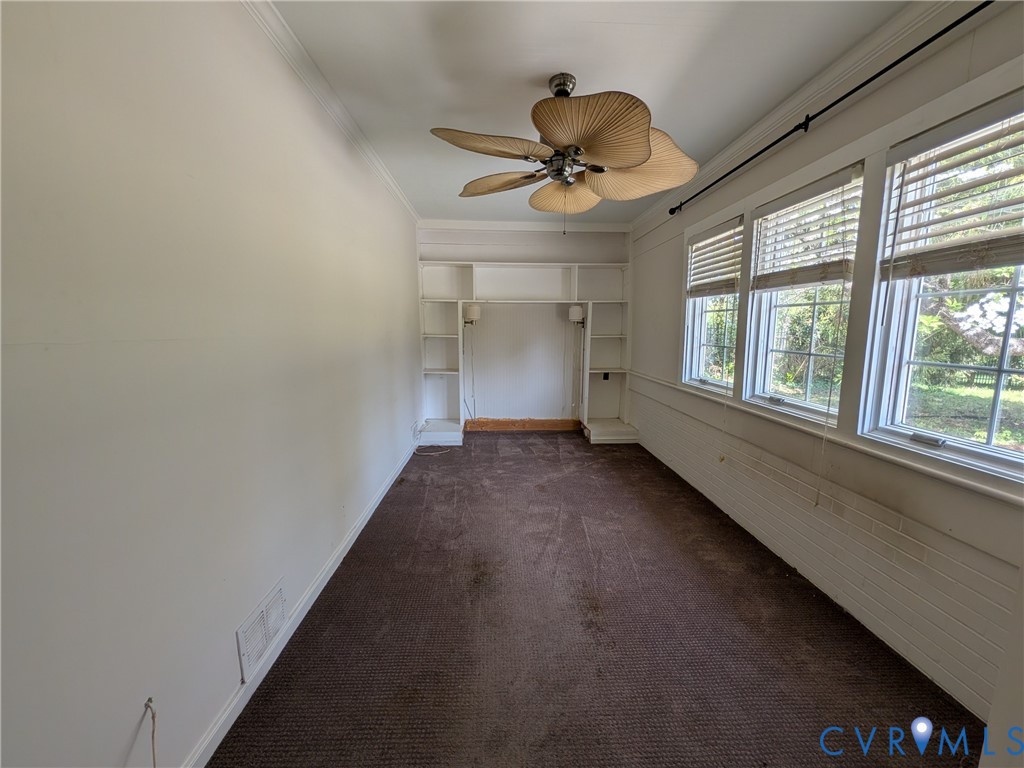 12307 Buckingham Street Chester, VA 23831 - Photo 18 of 40 a view of a livingroom with a ceiling fan and window