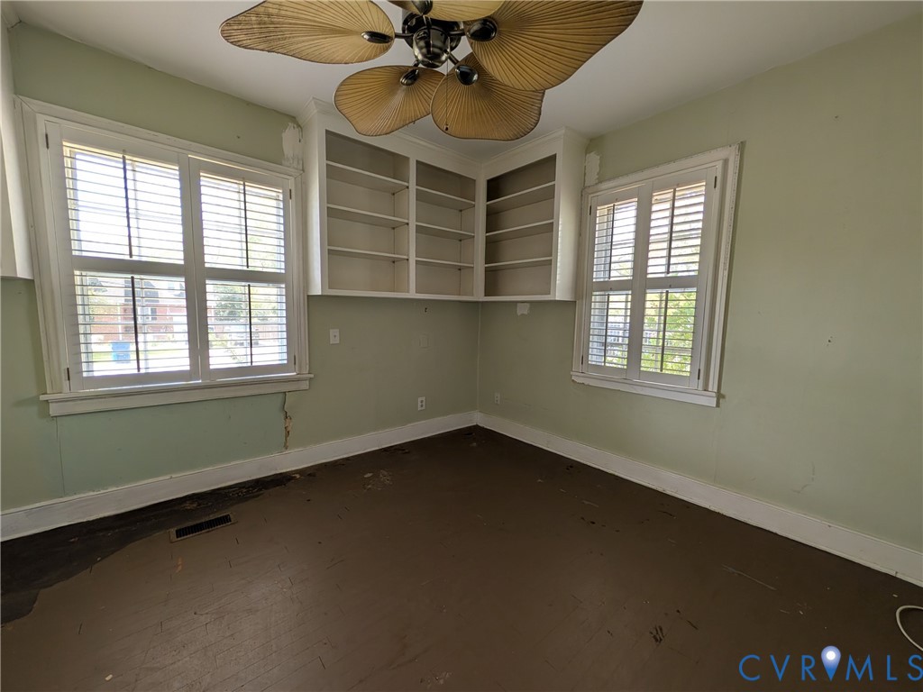 12307 Buckingham Street Chester, VA 23831 - Photo 21 of 40 an empty room with a window and a fan