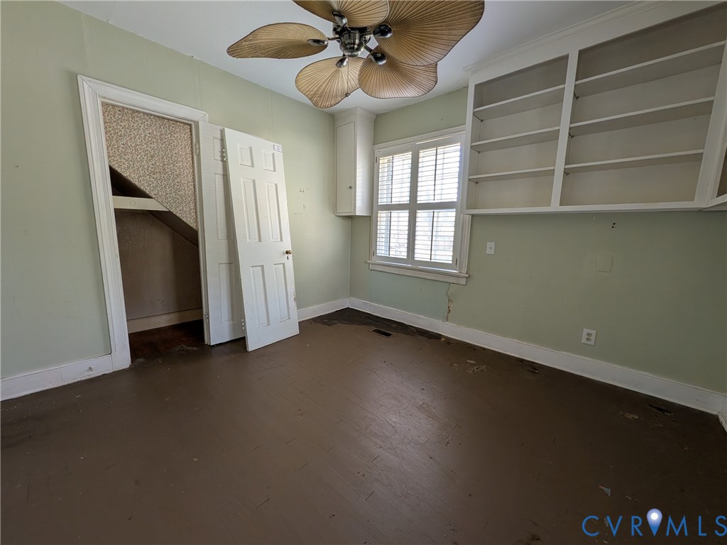 12307 Buckingham Street Chester, VA 23831 - Photo 22 of 40 a view of an empty room with a window and wooden floor
