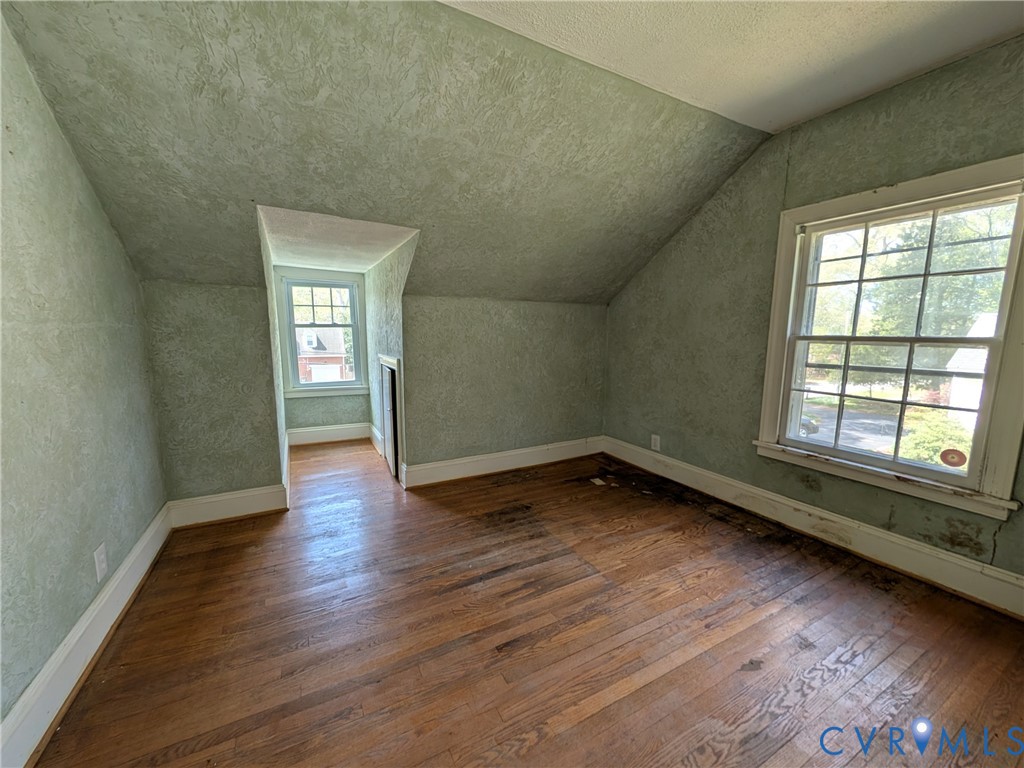 12307 Buckingham Street Chester, VA 23831 - Photo 27 of 40 an empty room with wooden floor and windows