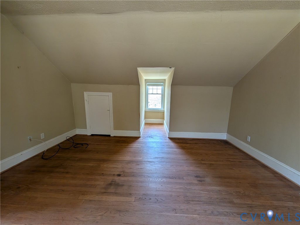 12307 Buckingham Street Chester, VA 23831 - Photo 33 of 40 a view of an empty room with wooden floor and window