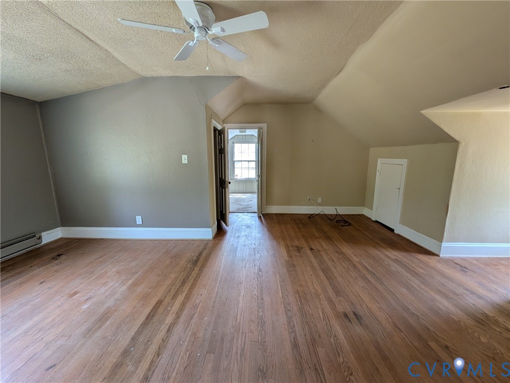 12307 Buckingham Street Chester, VA 23831 - Photo 34 of 40 an empty room with wooden floor and windows