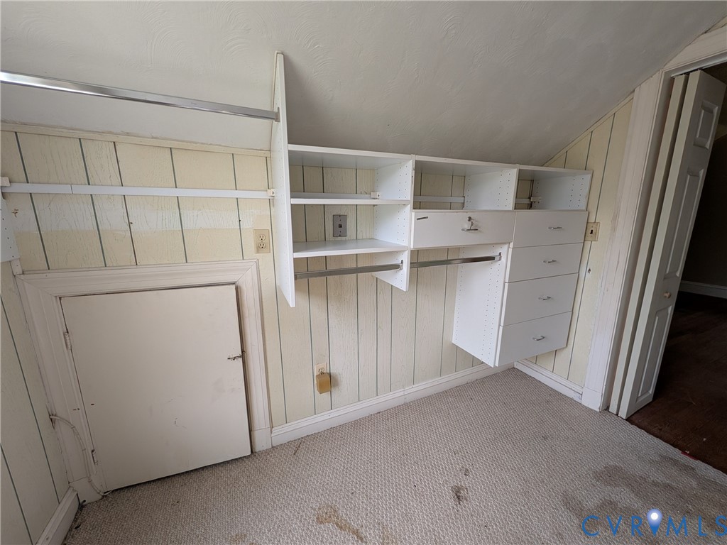 12307 Buckingham Street Chester, VA 23831 - Photo 37 of 40 a view of walk in closet with empty racks