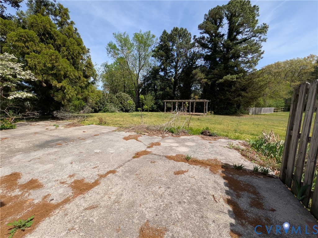 12307 Buckingham Street Chester, VA 23831 - Photo 5 of 40 a view of a yard with plants and trees