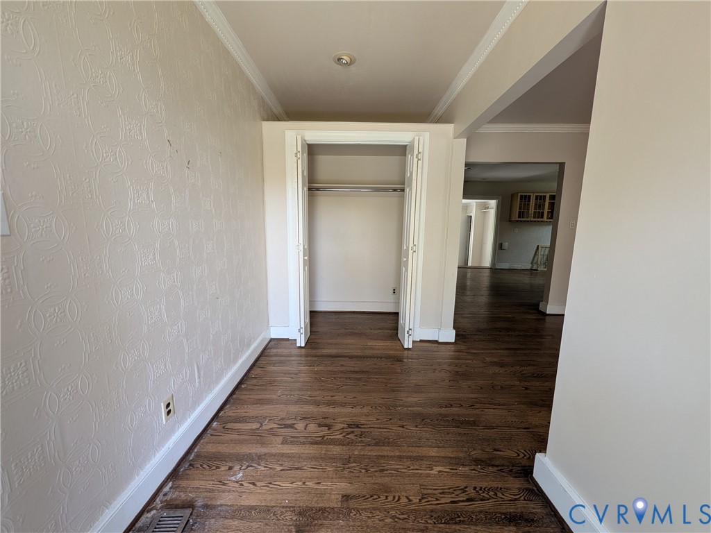 12307 Buckingham Street Chester, VA 23831 - Photo 9 of 40 a view of a hallway with wooden floor and staircase