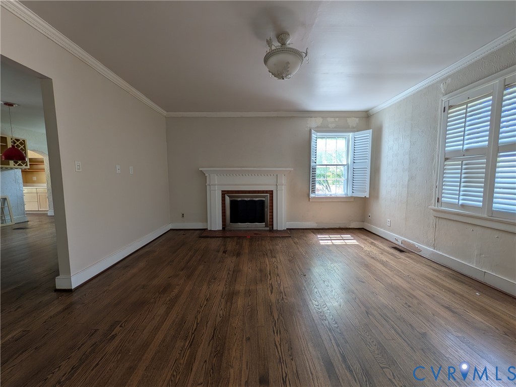 12307 Buckingham Street Chester, VA 23831 - Photo 10 of 40 an empty room with wooden floor and windows