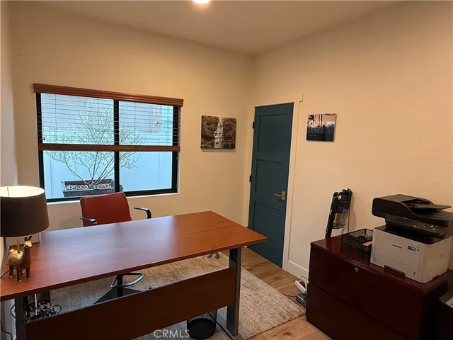 a view of a workspace with furniture