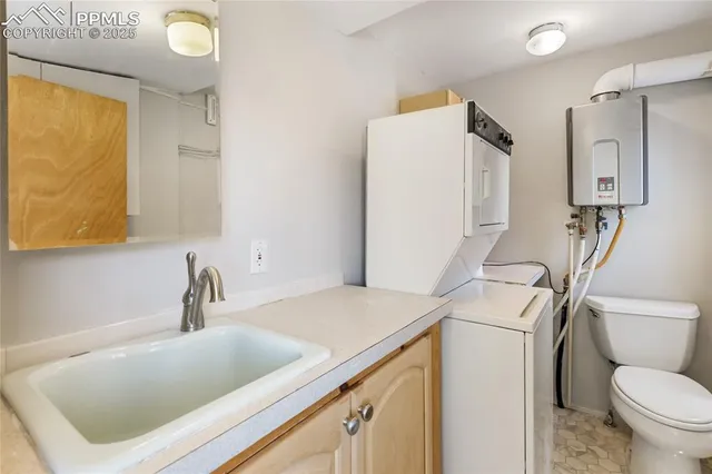 a white toilet sitting next to a shower