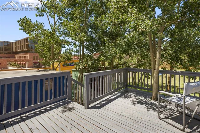 a view of a patio with two chairs and a table