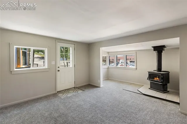 a kitchen with white cabinets and a sink