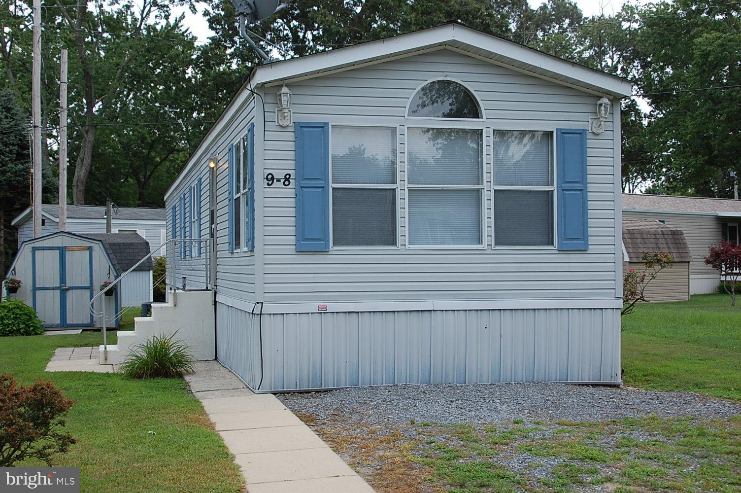Front of House with two parking spaces.