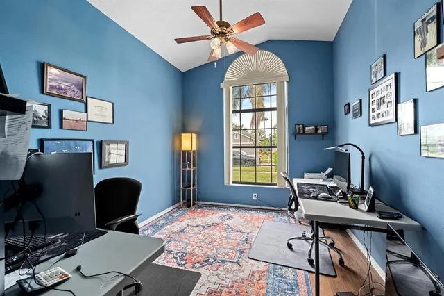 a workspace with furniture and a window