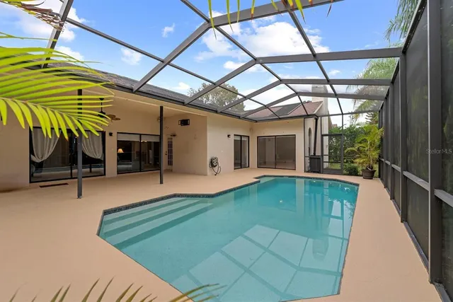 a view of swimming pool with a patio