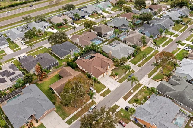 an aerial view of residential houses with outdoor space