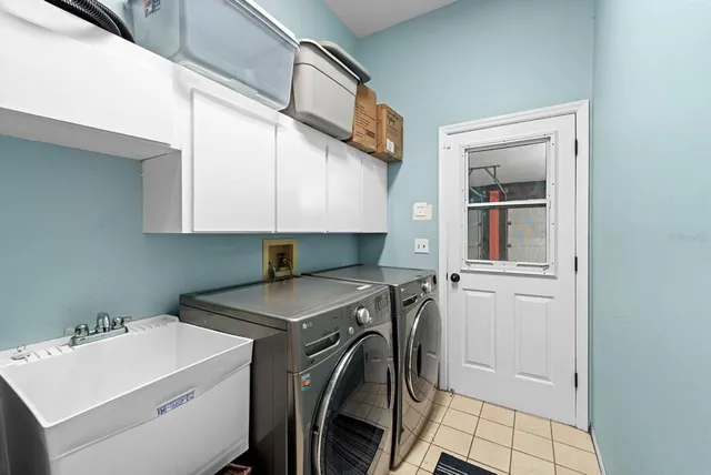 a utility room with dryer and washer