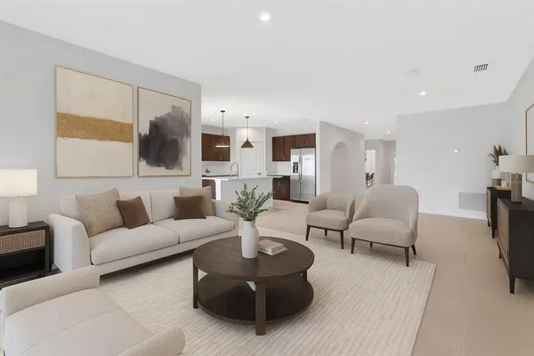 a living room with furniture and a large window